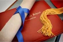 Graduation book and diploma