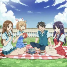 A group of friends enjoying a picnic together during the summer