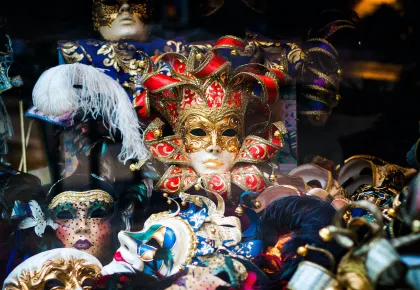 Brightly costumed Mardi Gras celebrators