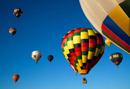 Multi-colored hot air balloons in the sky